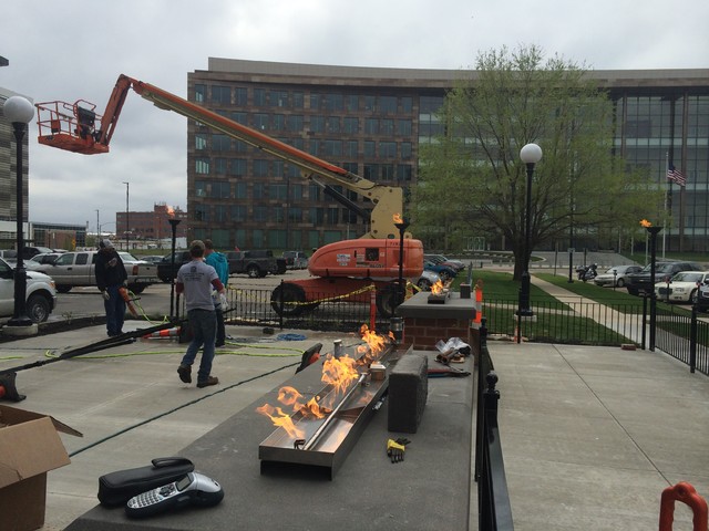 Black Sheep Social Club outdoor patio in Cedar Rapids, Iowa with gas torches and built-in fire features